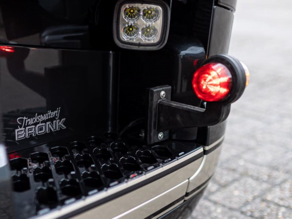 Danish LED side lamp orange - red with transparent glass - mounted in the front bumper of a Scania truck