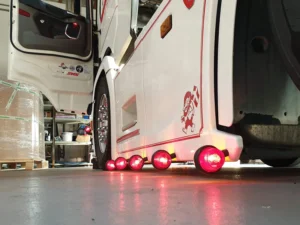 Danish side lamp with Gylle lens RED - mounted with mounting base on side skirt Scania - EAN: 7392847307866