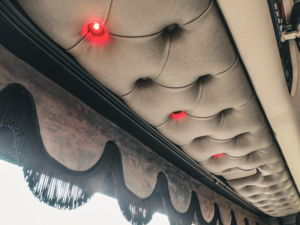 Truck interior with red lighting built into the sun visor plate